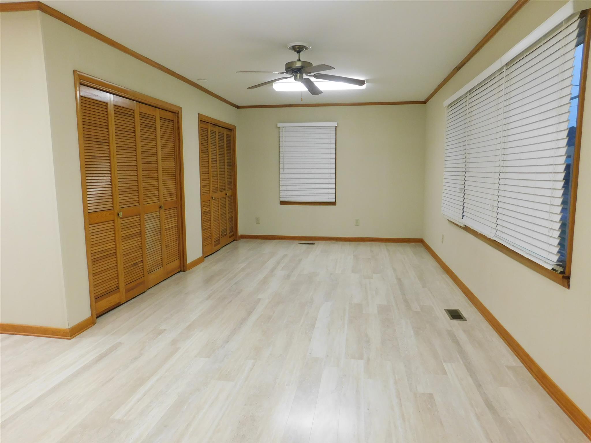 206 Ragan Street Tullahoma, TN 37388 - Photo 7 of 24 Den has new flooring and a large closet and washer/dryer closet.