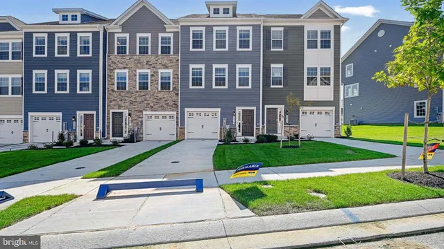 a small yard in front of a brick building