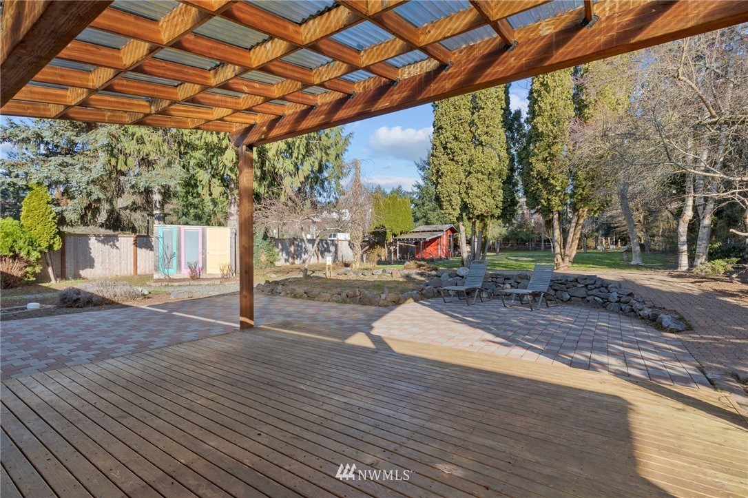 645 240th Street Southeast Bothell, WA 98021 - Photo 23 of 25 a view of outdoor space with wooden floor and fence