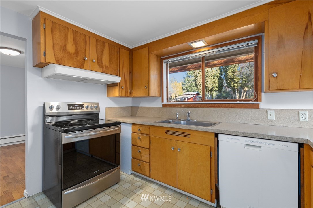 645 240th Street Southeast Bothell, WA 98021 - Photo 9 of 25 a kitchen with appliances cabinets and a sink