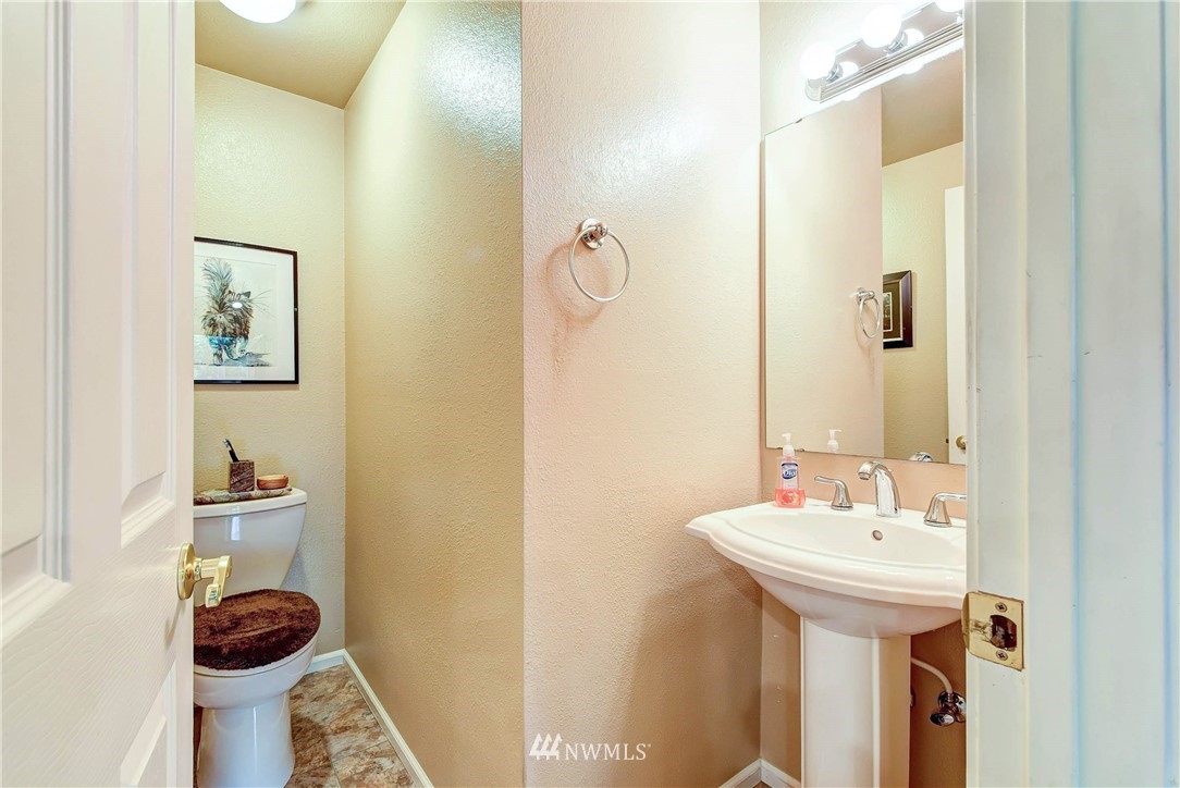 14221 Seattle Hill Road Snohomish, WA 98296 - Photo 23 of 38 a bathroom with a sink and mirror with toilet