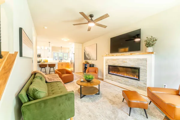 a living room with furniture and a fireplace