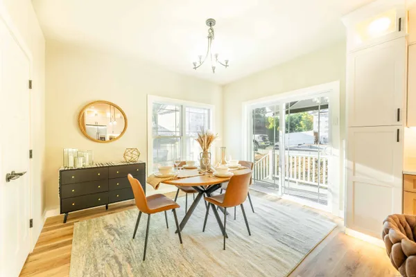 a view of a dining room with furniture window and wooden floor