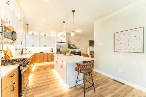 a large room with lots of counter space and windows