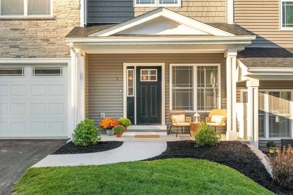 a front view of a house with garden