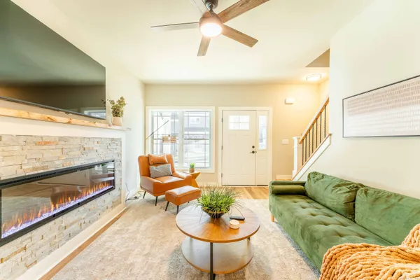 a living room with furniture and a fireplace