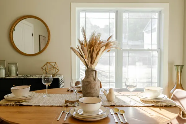 a living room with a large window and table