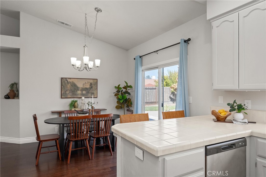 1921 Ascolano Way Chico, CA 95928 - Photo 19 of 42 a view of a dining room with furniture window and wooden floor