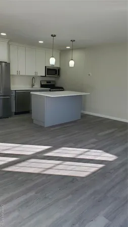a view of kitchen with microwave and stove