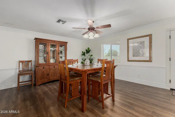 a view of a dining room with furniture window and wooden floor