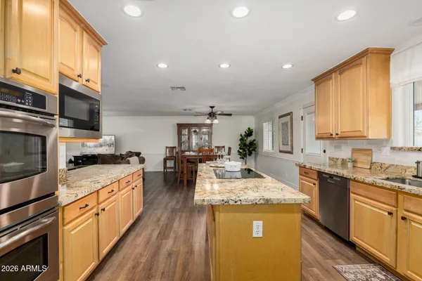 a kitchen with a sink stove and refrigerator