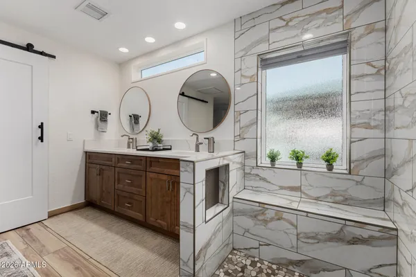 a bedroom with a bed and a television