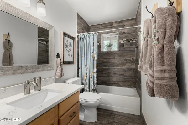 a view of a livingroom with furniture and a flat screen tv