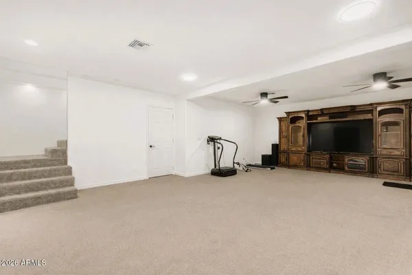 a view of a livingroom with a flat screen tv and a couch