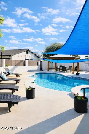 a kitchen with stainless steel appliances kitchen island granite countertop a stove a sink and a microwave