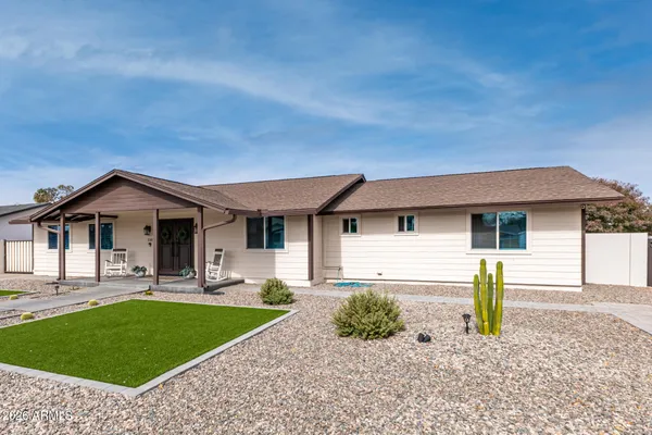 a front view of a house with garden