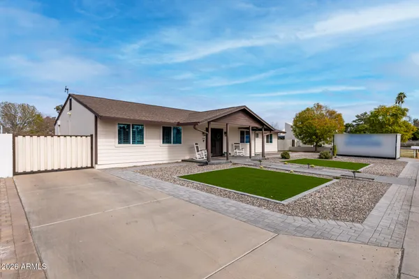 a front view of a house with garage and yard