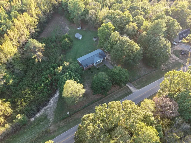 a front view of a house with yard and porch