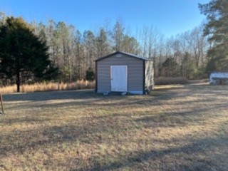 3190 Plainview Road Henderson, TN 38340 - Photo 4 of 6 a house with trees in front of it