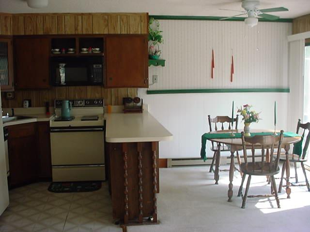 1044 Canterbury Road Bushkill, PA 18324 - Photo 1 of 8 a kitchen with a sink cabinets and window