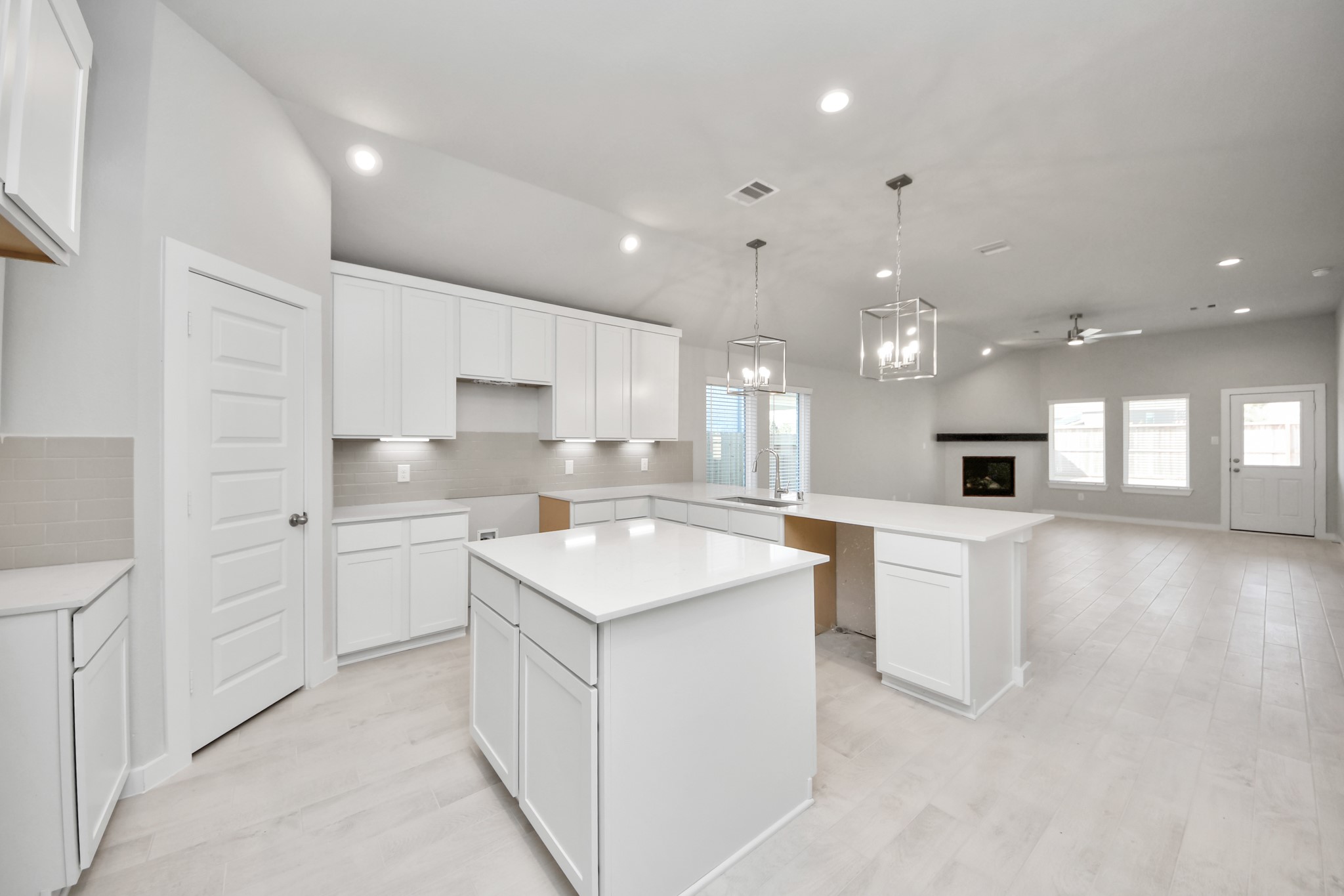 15707 Telge Ridge Lane Cypress, TX 77429 - Photo 15 of 38 a kitchen with white cabinets appliances and sink