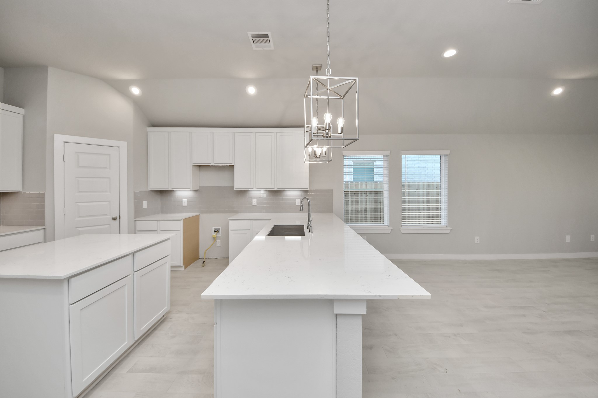 15707 Telge Ridge Lane Cypress, TX 77429 - Photo 20 of 38 a large kitchen with kitchen island a sink appliances and cabinets