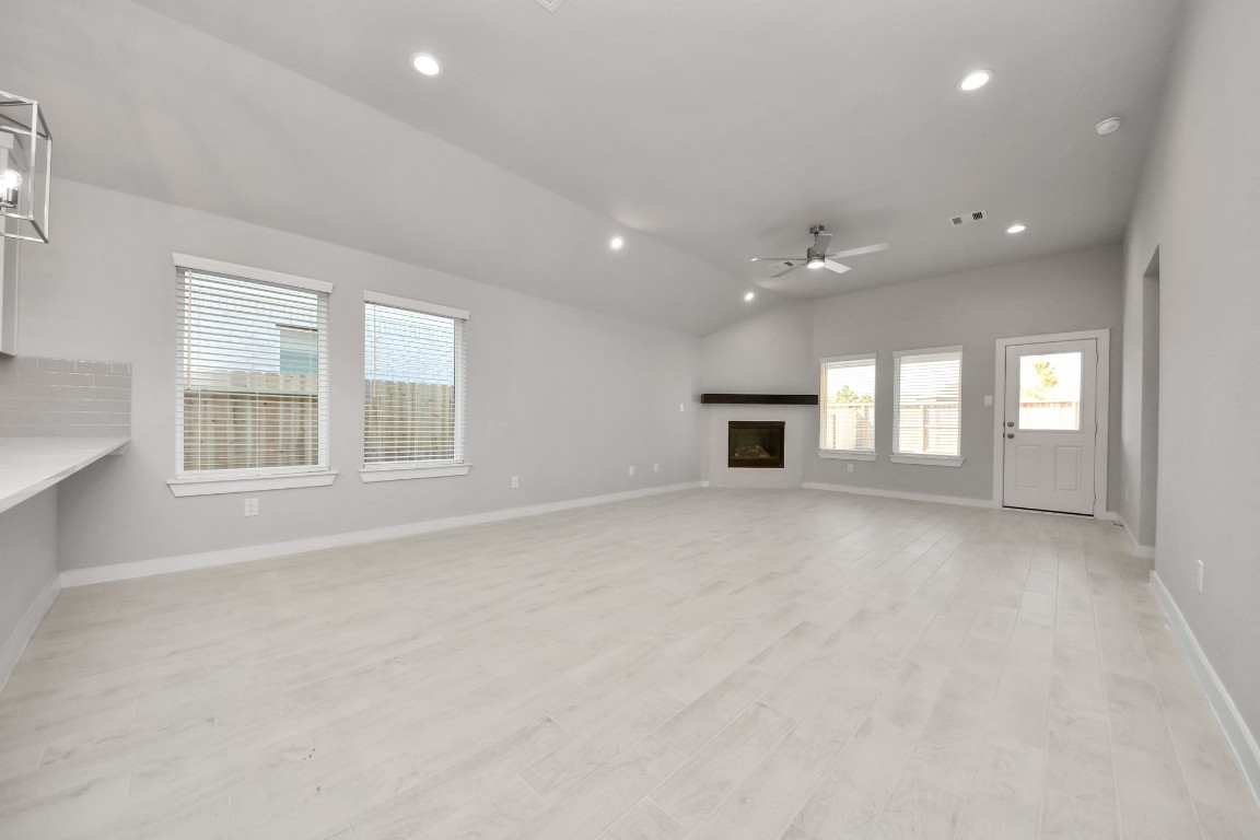 15707 Telge Ridge Lane Cypress, TX 77429 - Photo 23 of 38 an empty room with windows and fireplace