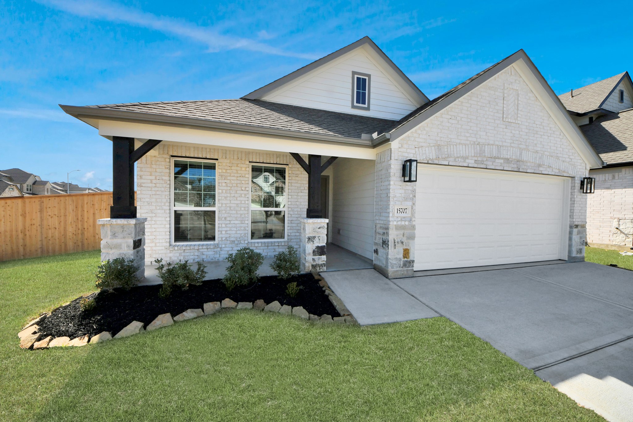 15707 Telge Ridge Lane Cypress, TX 77429 - Photo 2 of 38 a front view of a house with a garden and plants
