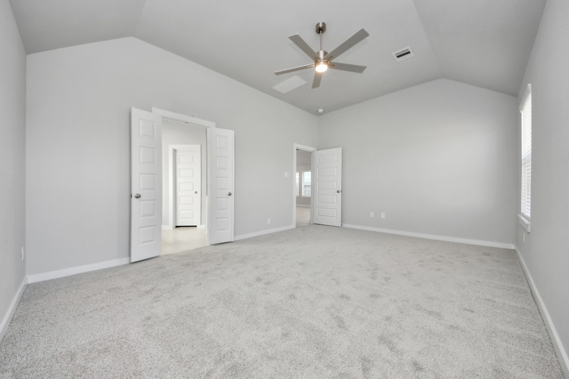 15707 Telge Ridge Lane Cypress, TX 77429 - Photo 28 of 38 an empty room with a ceiling fan and a window