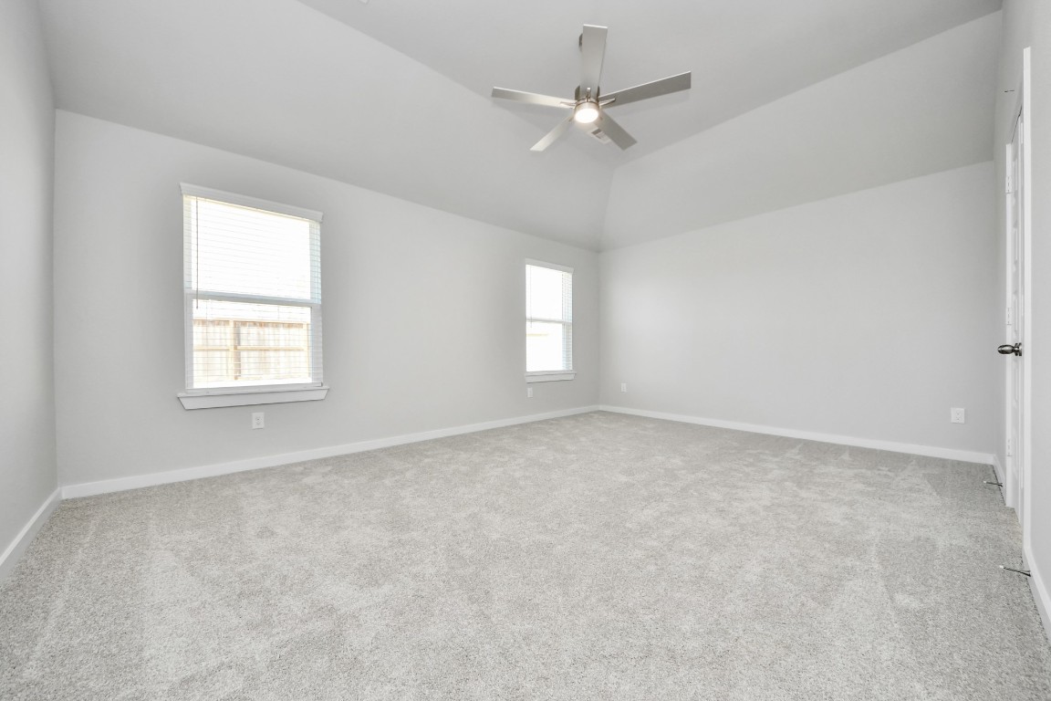 15707 Telge Ridge Lane Cypress, TX 77429 - Photo 30 of 38 an empty room with a window and a fan