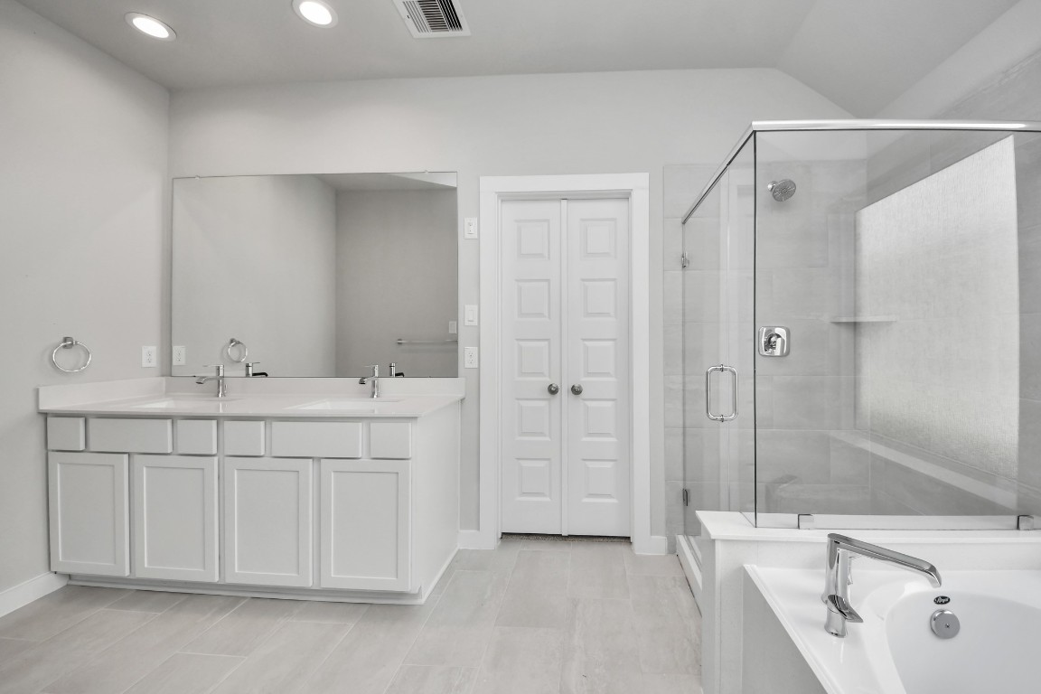 15707 Telge Ridge Lane Cypress, TX 77429 - Photo 33 of 38 a bathroom with a double vanity sink mirror and shower