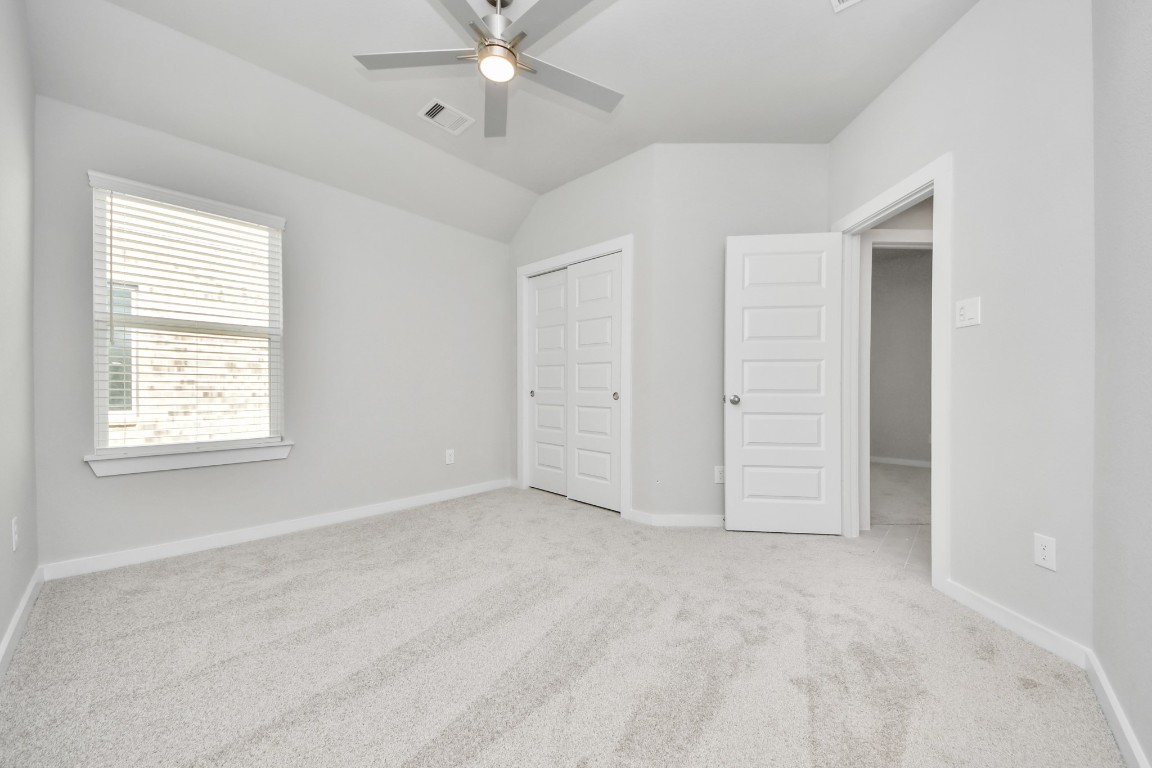 15707 Telge Ridge Lane Cypress, TX 77429 - Photo 35 of 38 an empty room with fan and windows