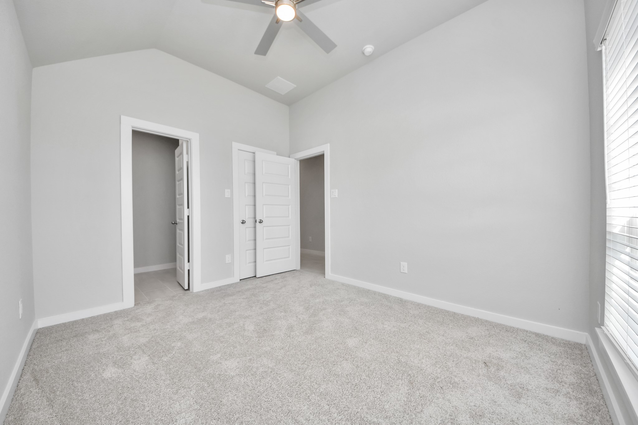 15707 Telge Ridge Lane Cypress, TX 77429 - Photo 10 of 38 an empty room with fan and windows