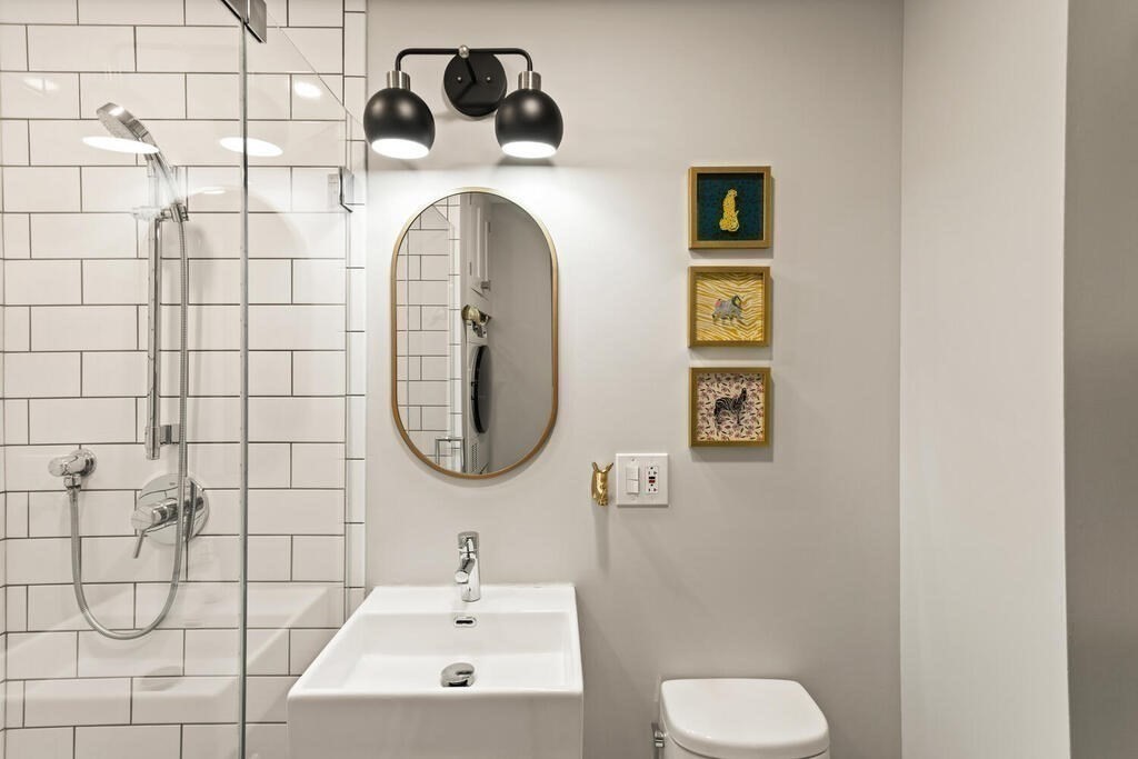 473 Beacon Street, Unit 5 Boston, MA 02115 - Photo 13 of 21 a bathroom with a toilet sink and mirror