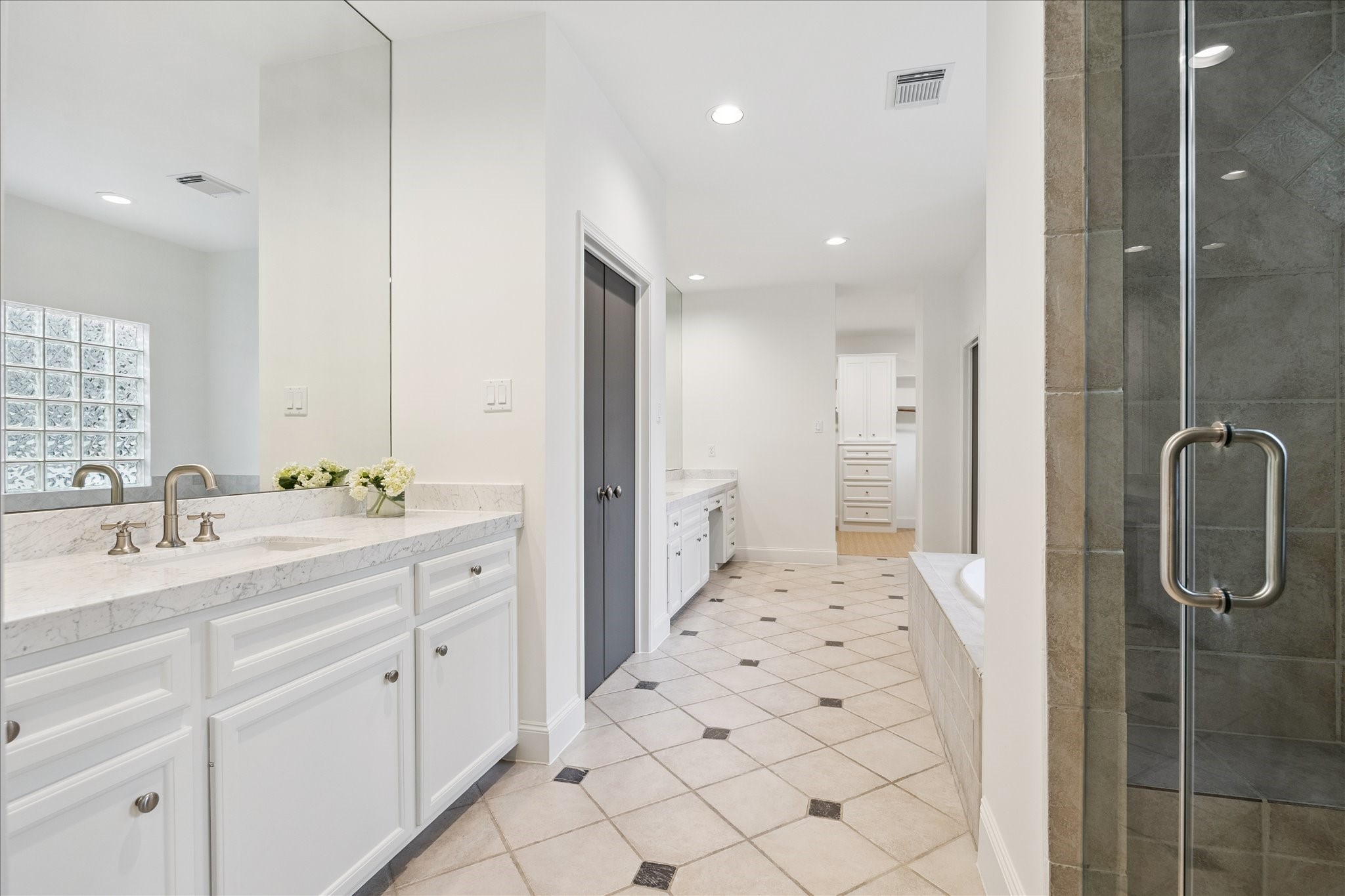 3958 West Alabama Street Houston, TX 77027 - Photo 15 of 30 The primary bath also boasts marble countertop dual vanities and two large walk-in closets!