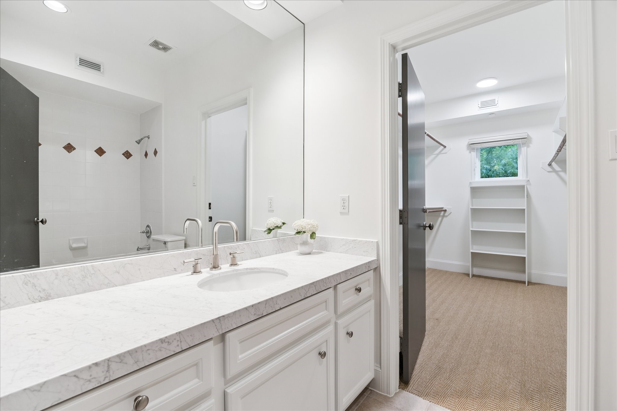 3958 West Alabama Street Houston, TX 77027 - Photo 20 of 30 This beautiful en-suite bath offers marble countertops and a large walk-in closet.