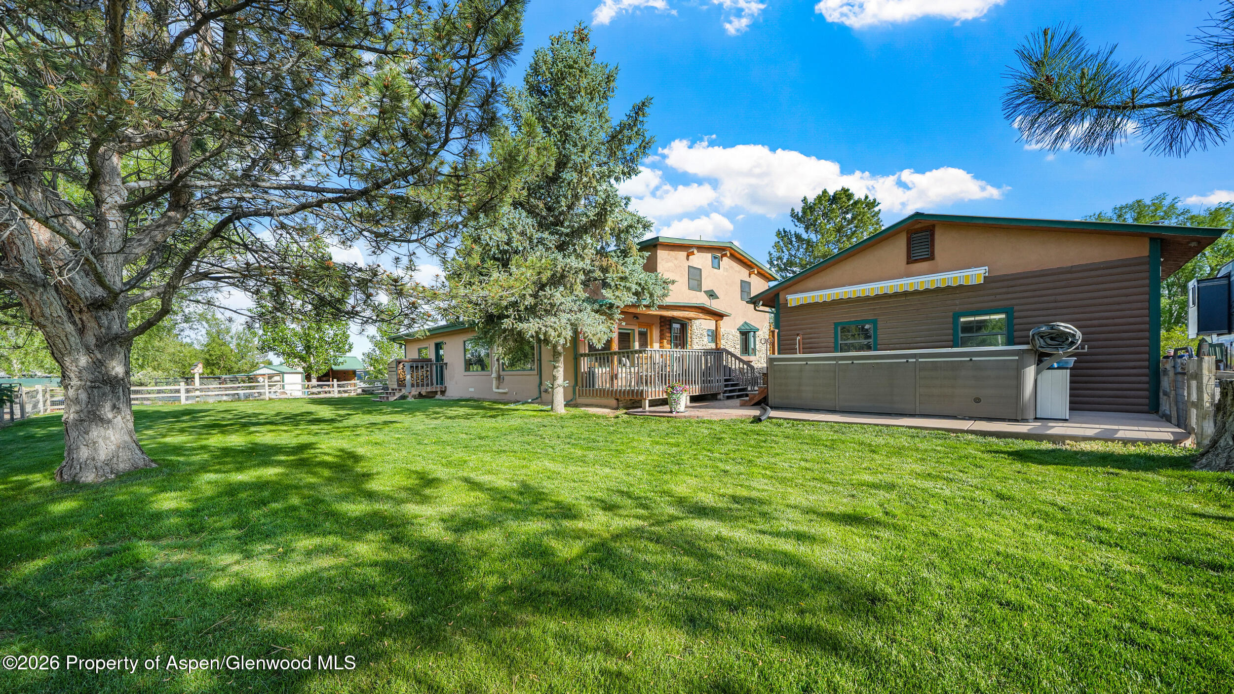1355 N Road Loma, CO 81524 - Photo 35 of 51 a front view of house with yard and trees