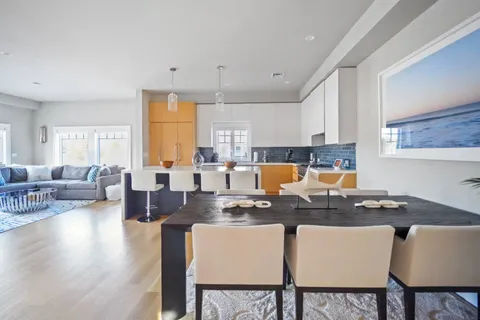 a very nice looking dining room with a table and chairs