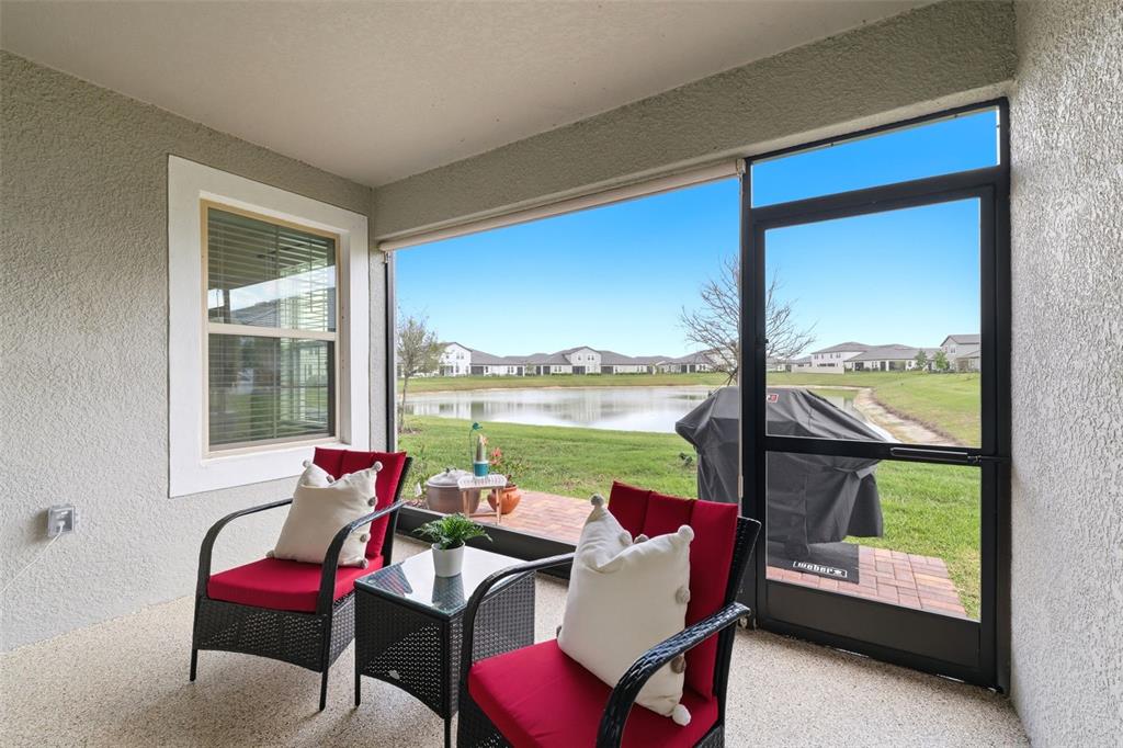 10799 Gable Dig Loop San Antonio, FL 33576 - Photo 16 of 19 a room with furniture and a large window