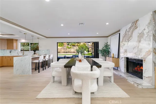 a living room with fireplace furniture and a fireplace