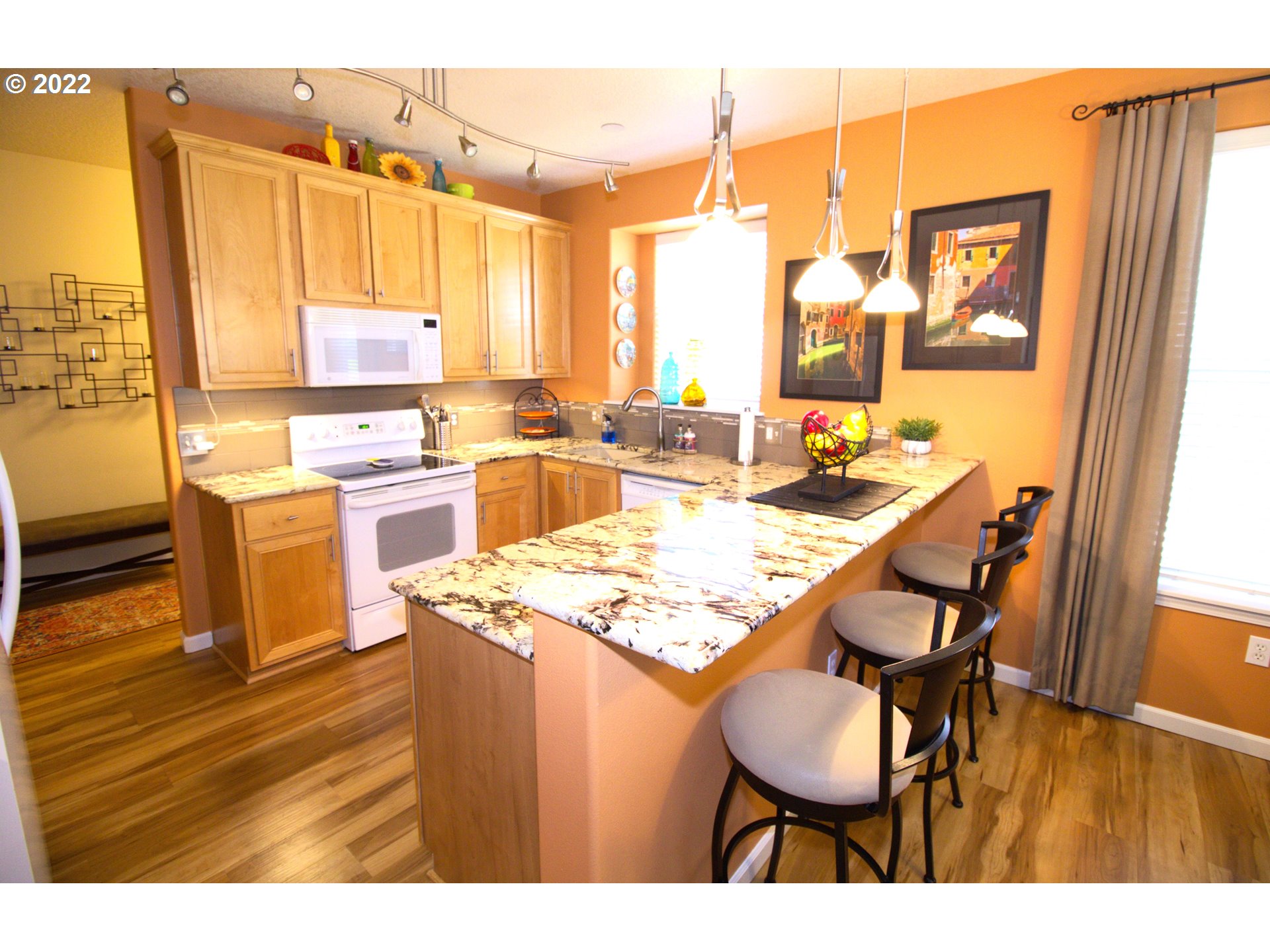 4520 Southwest 11th Street Gresham, OR 97080 - Photo 5 of 30 a open kitchen with a table and chairs in it