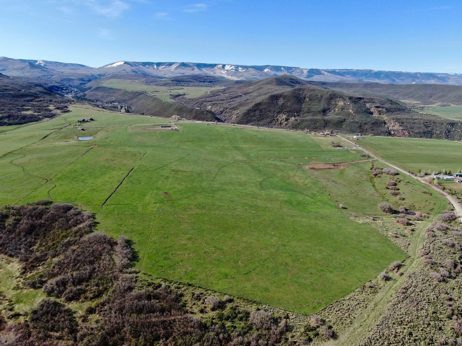 57178 Oe Road Collbran, CO 81624 - Photo 19 of 41 a view of a field with an ocean
