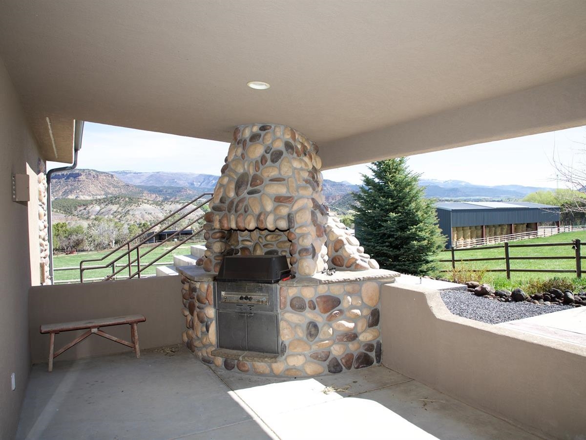 57178 Oe Road Collbran, CO 81624 - Photo 23 of 41 a building outdoor space with patio furniture and a potted plant