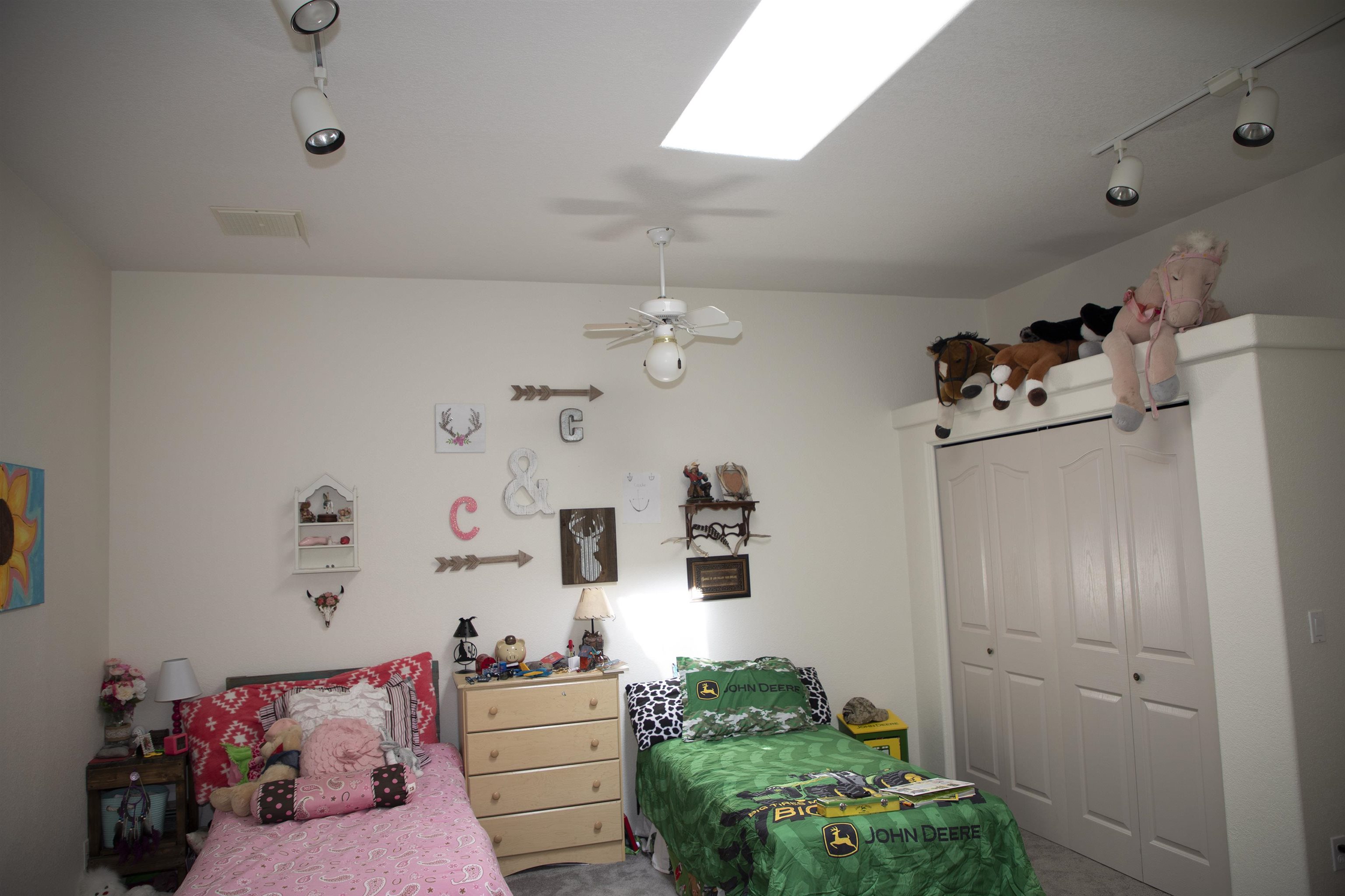 57178 Oe Road Collbran, CO 81624 - Photo 31 of 41 a bedroom with furniture and a chandelier fan