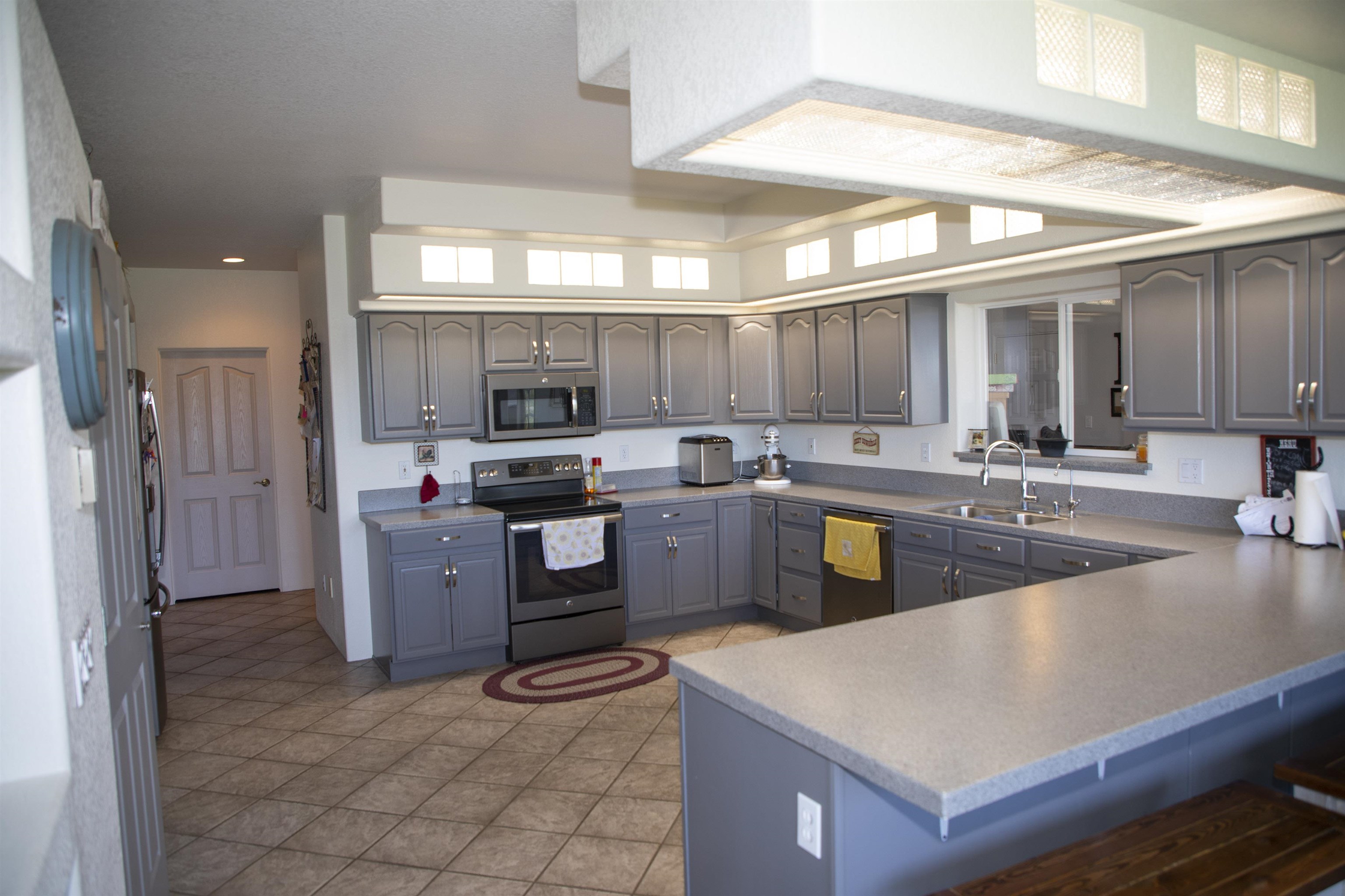 57178 Oe Road Collbran, CO 81624 - Photo 33 of 41 a kitchen with sink a refrigerator and cabinets