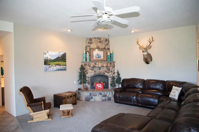 a living room with furniture a fireplace and couch