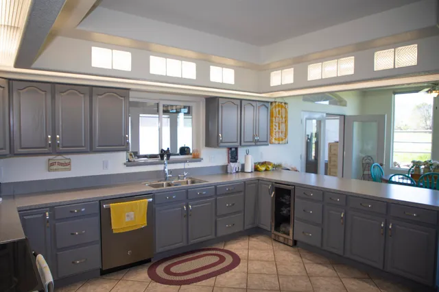 a spacious bathroom with a granite countertop sink mirror and toilet