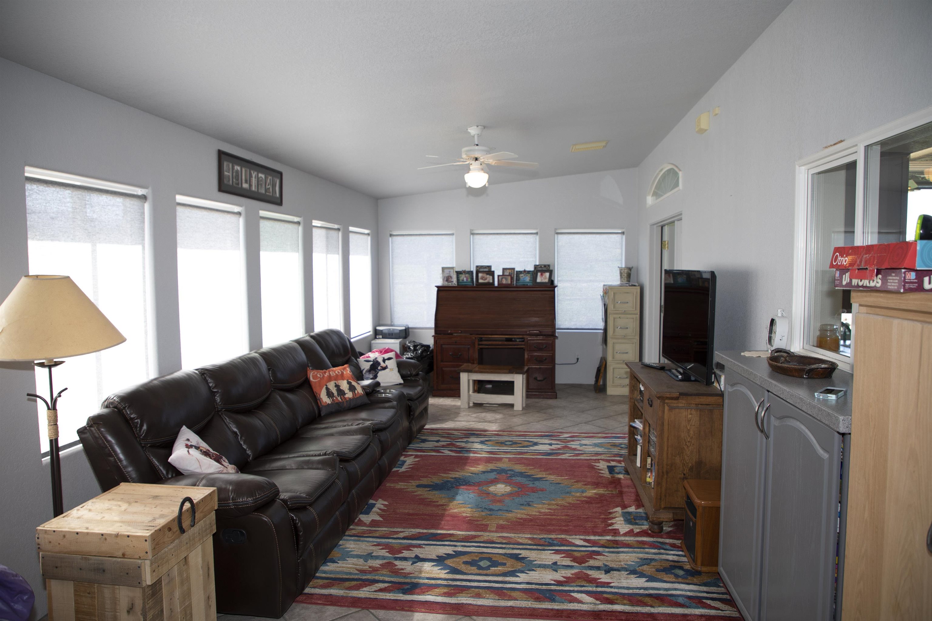 57178 Oe Road Collbran, CO 81624 - Photo 40 of 41 a living room with furniture a flat screen tv and a fireplace