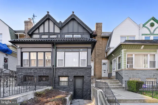 a front view of a house with a porch