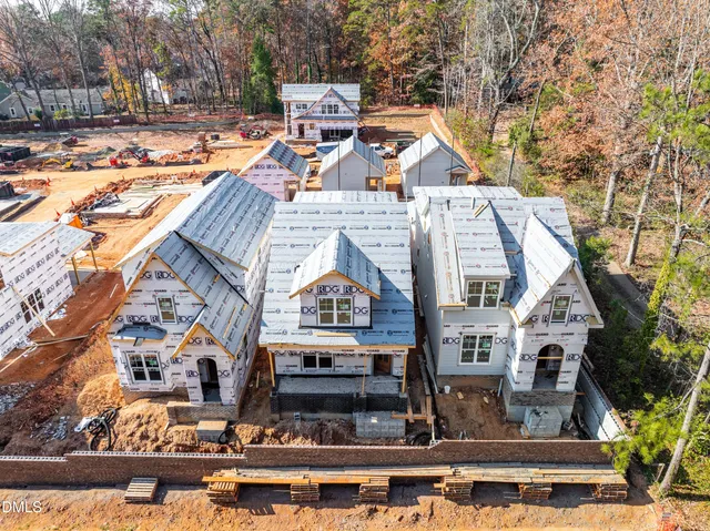 a view of multiple houses with a street